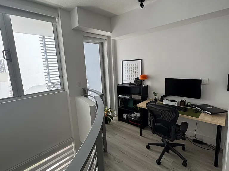 Cozy Office Nook - Adjacent to your bedroom, this nook boasts enough space for a sizable office area, reading space, or extra storage with plenty of natural light and access to your second story balcony. Perfect for WFH, studying, or creative projects.