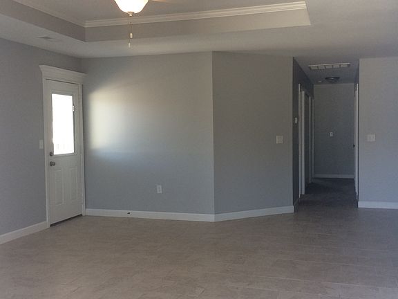 Large open living room with tile floors