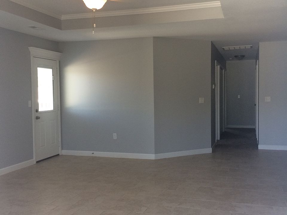 Large open living room with tile floors