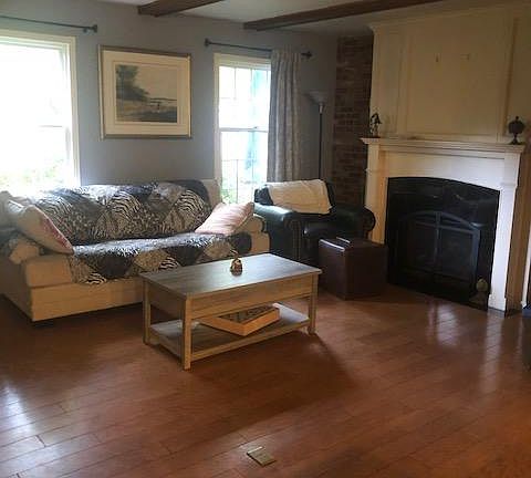 Family room with gas fireplace and TV