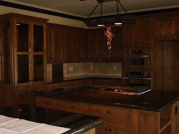 Built in gorgeous 2 sided cabinet with glass doors between kitchen and dining