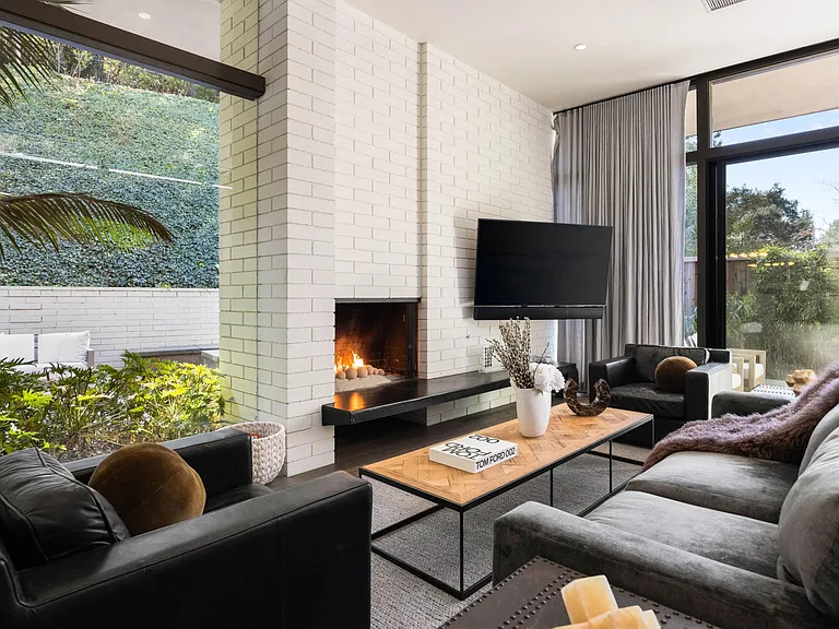 Admire the modern design elements that seamlessly blend sophistication with coziness, making it an ideal retreat.