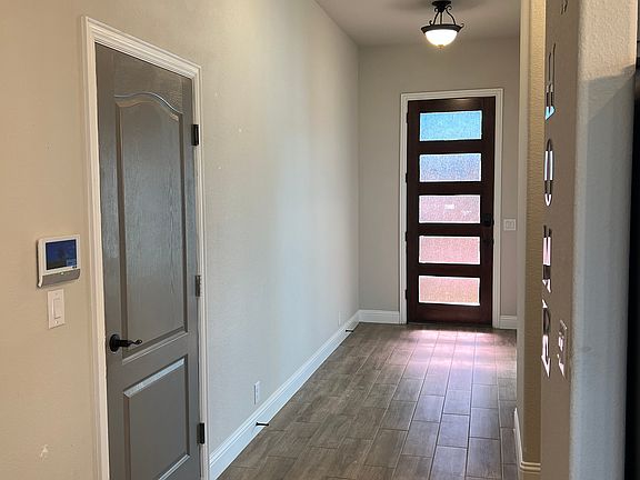 Front Entrance and door to garage (garage is clean, sorry no pics). Double car garage.