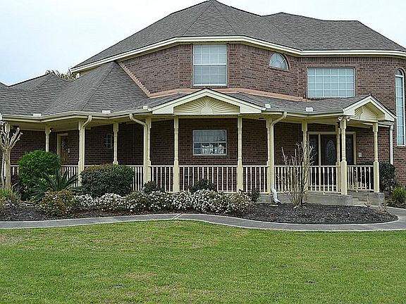 Large wrap-around porch welcomes neighbors and friends.