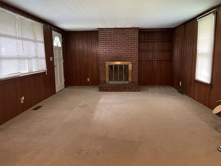 Family room with door to carport