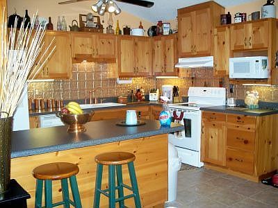 Custom kitchen with "old world" charm back splash.