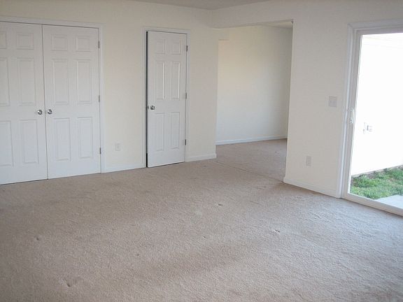 Basement is a large bonus room w/ half bath and patio access.