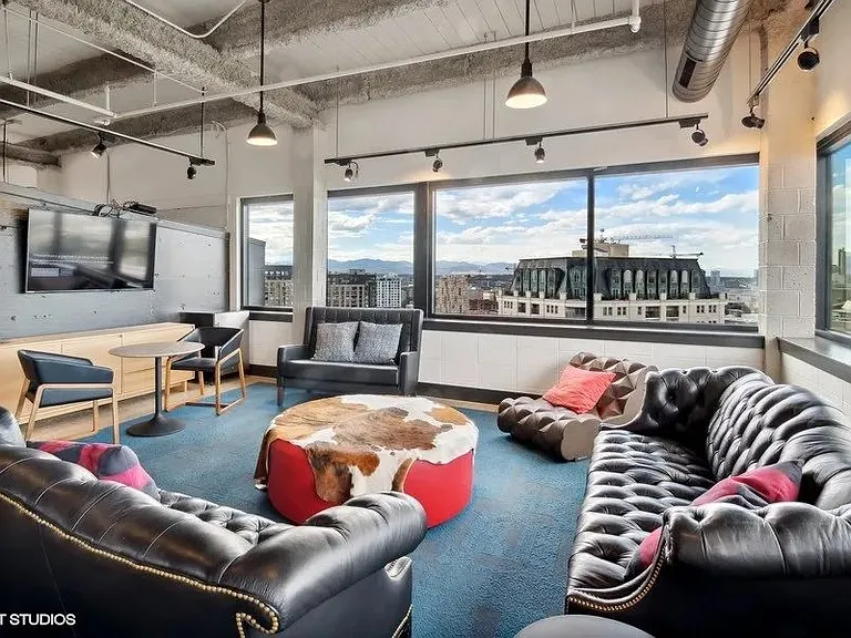 Penthouse entertainment lounge with comfortable seating at Archer Tower in Denver, CO