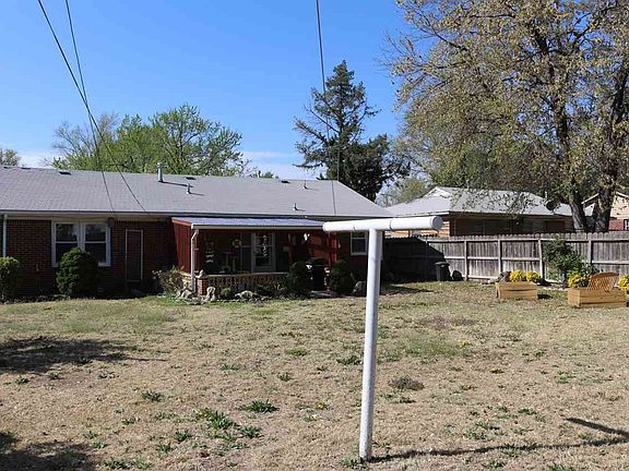 view of the back of the house with clothesline