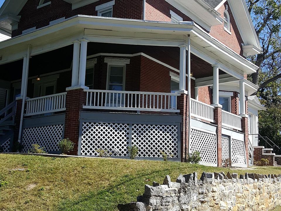 Front corner of the house and wrap around porch. Large yard