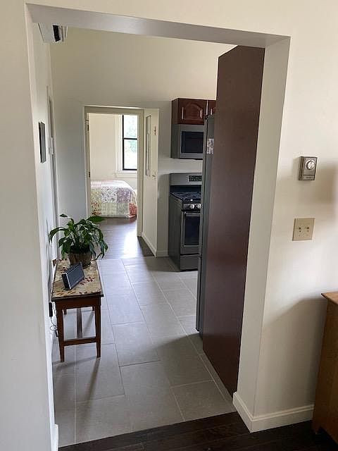 View of hall from Living room thru Kitchen to Bedroom