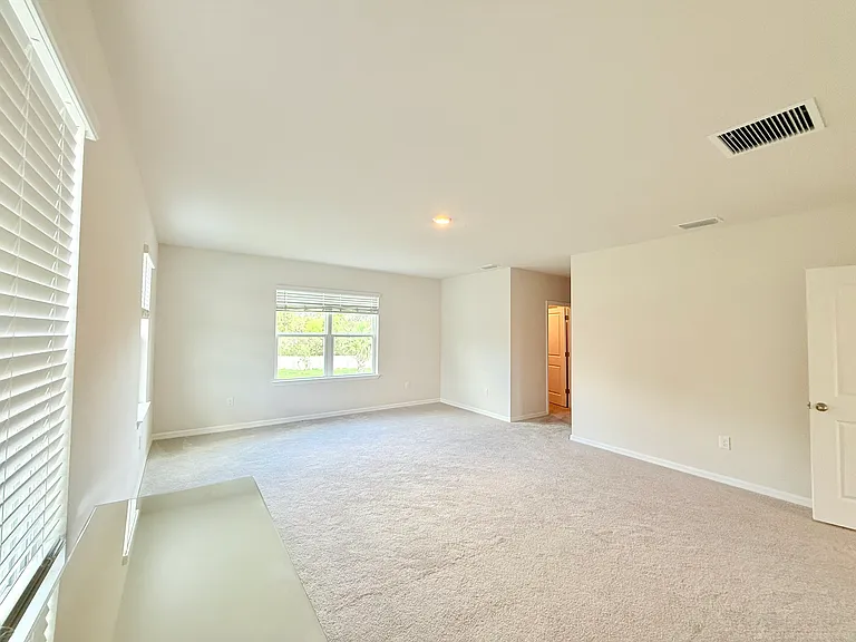 Large Master Bedroom with Pond View and 2 large walk-in closets.