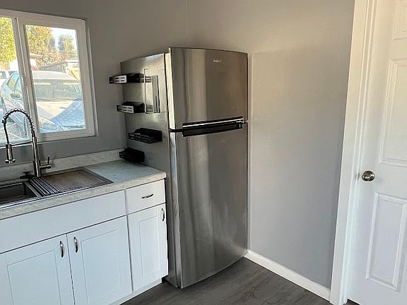 New Whirlpool 18 cu. ft. Top Freezer Refrigerator in Stainless Steel (Loews)