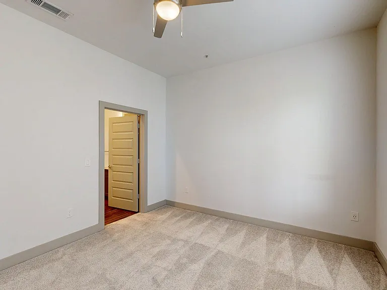 Spacious apartment Bedroom with Carpet Floor.
