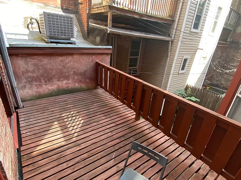 DECK, overlooking an enclosed courtyard