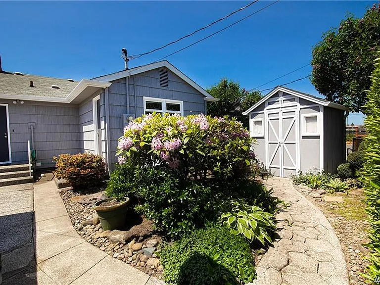 Beautiful landscaped yard with shed