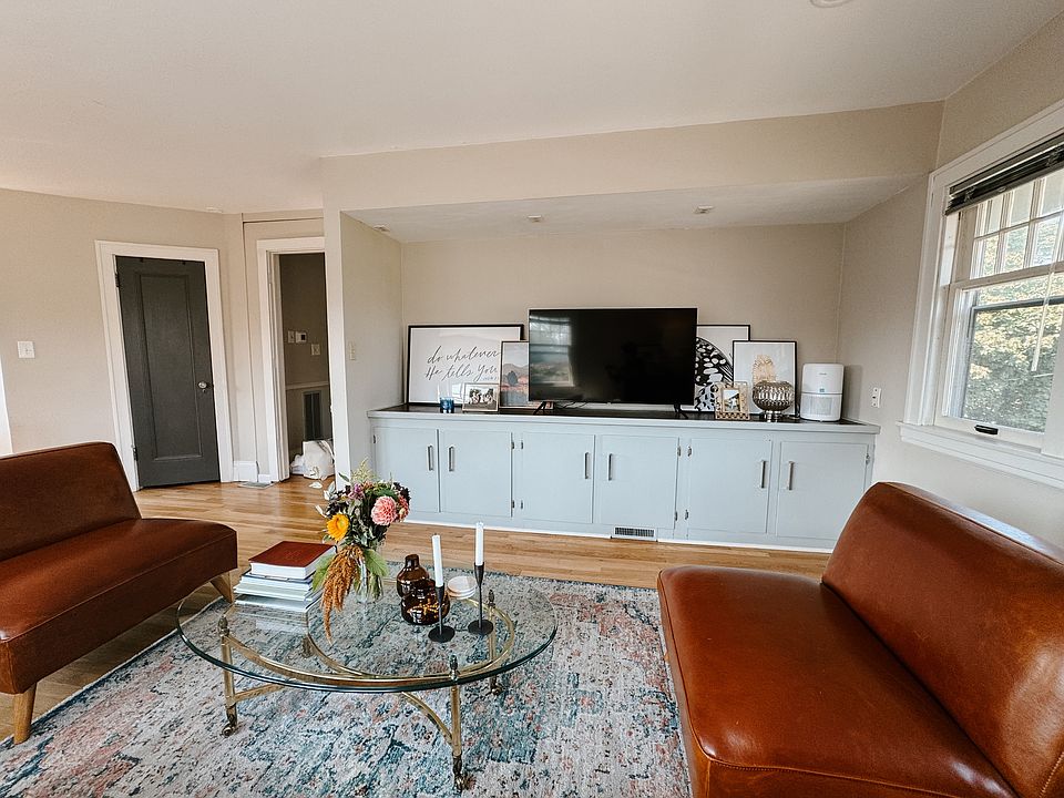 Living area with built in storage cabinets/counter.