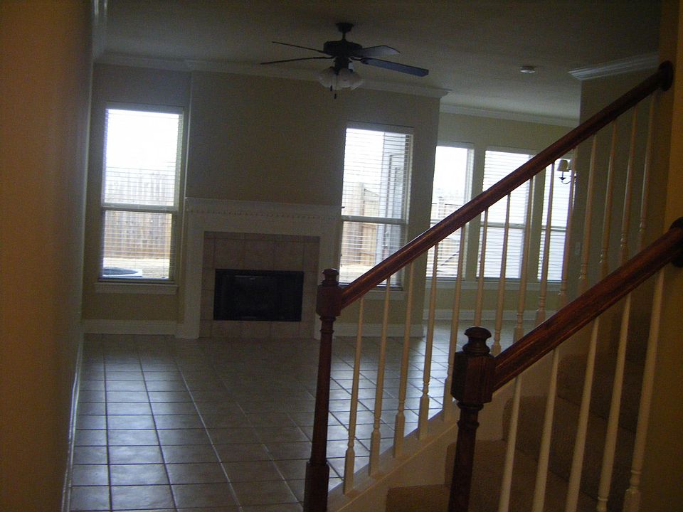 Easy care tile flooring and lots of light from all these windows. FP has gas starter. Lots of crown molding.