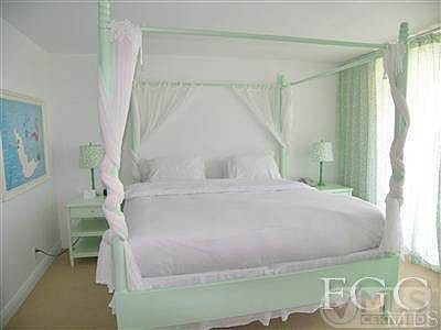 Dreamy bedroom with sliders to patio.