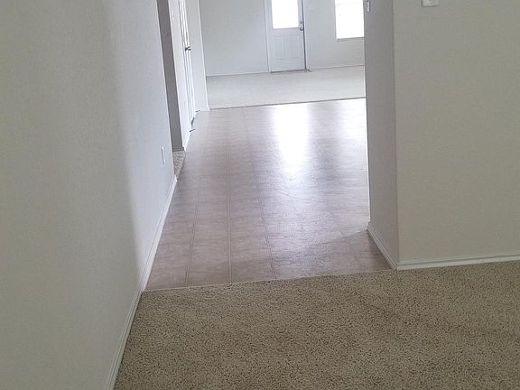 Passed the first living area you go into the open floor area to the kitchen, dinning and second living or family room.