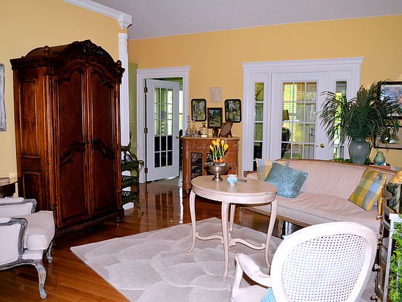 Living Area W/ Doors To The Sunroom Beyond