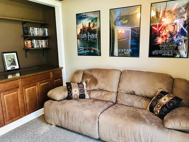 Den or 3rd guest bedroom with built in cabinets and shelves