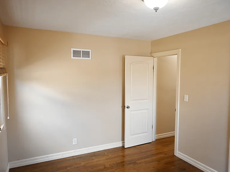 Overhead lighting in a bedroom at Square 131 5-Plex.