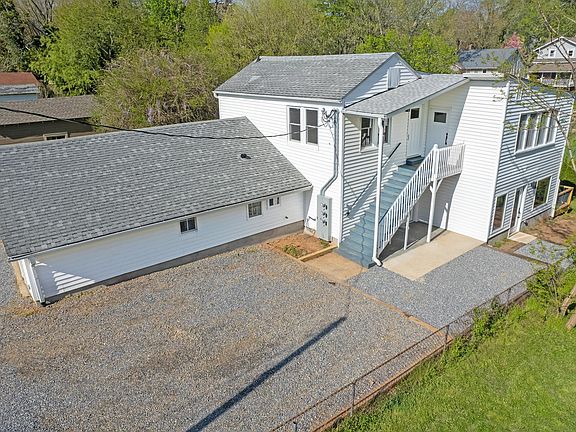 Carriage House; Unit 200 is upstairs, Unit 100 is downstairs, Garage is for owners use only.