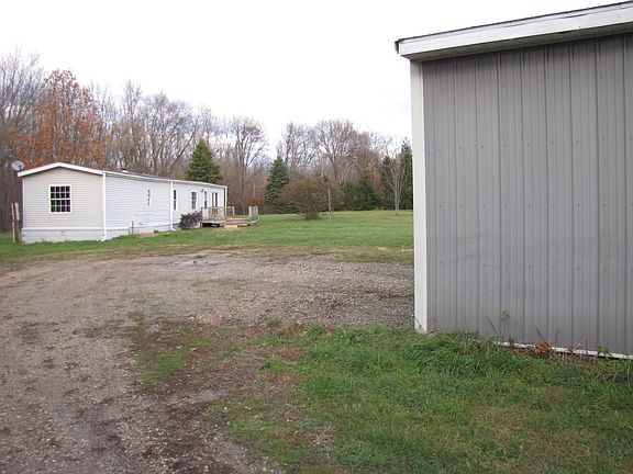 trailer and pole barn 
