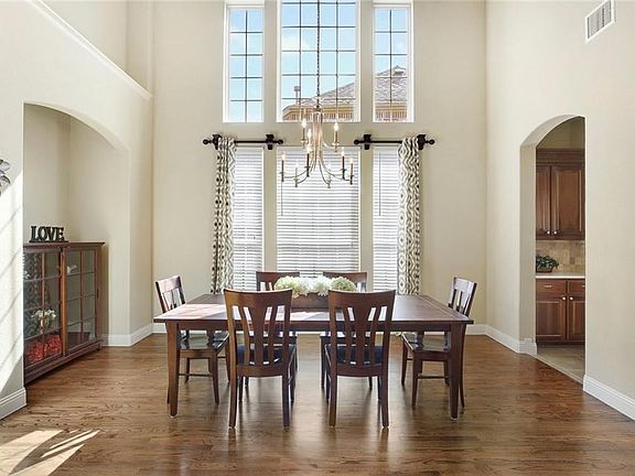 THIS DINING ROOM IS FIT FOR A KING WITH AMAZING FLOOR TO CEILING WINDOWS, A BUFFET NICHE, AND BUTLER'S PANTRY!