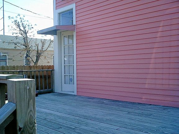 Great big Deck for outdoor entertaining overlooks fenced backyard w/auto gate