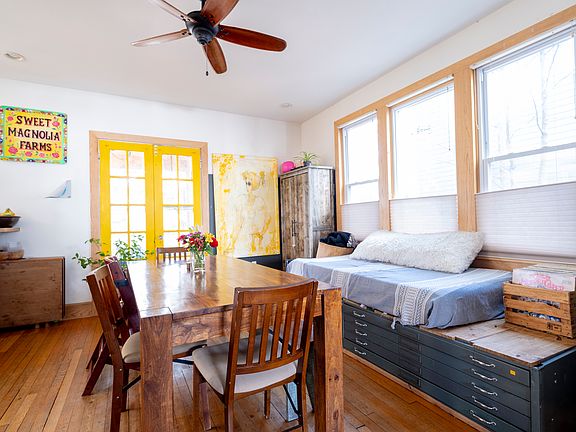 Dining room with daybed that looks out to the sunny side yard. Westward facing windows get beautiful afternoon sunlight.
