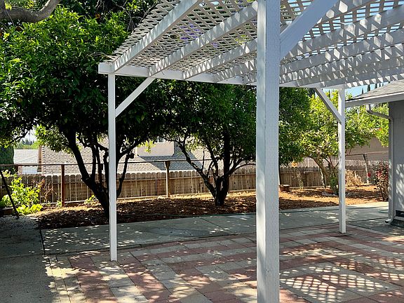 Backyard Patio and View of Orange Trees.