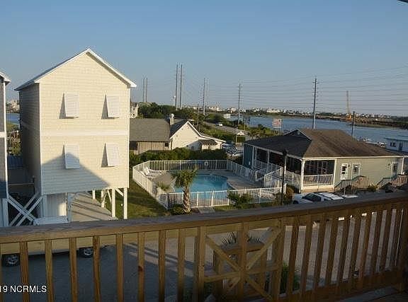 View from deck looking at the clubhouse and pool