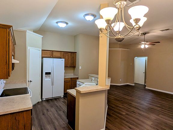 From dining looking into kitchen and living