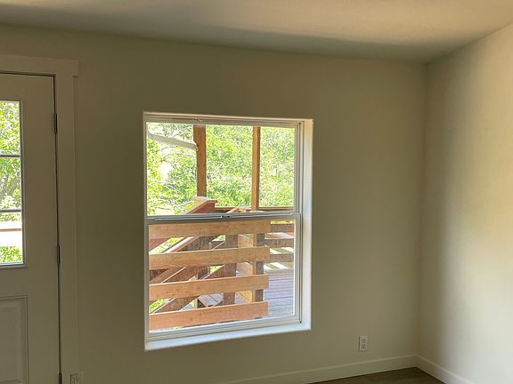 Living space, new floors, fresh paint, big window for lots of natural light!