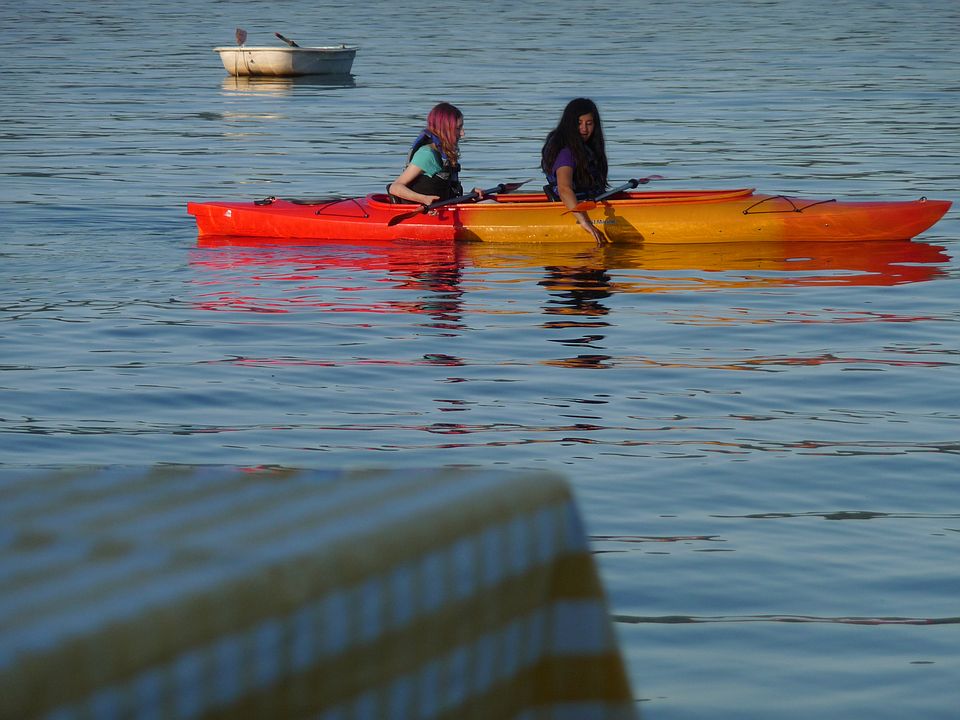 Kayaking out front of house.