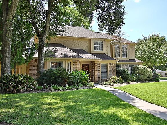 Mature trees throughout the neighborhood provide shade and beauty.