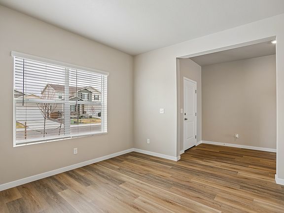 There is a dining room in front of the house off the kitchen.