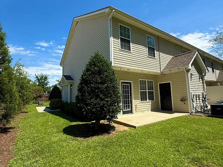 Nice patio and grass area. The yard belongs to the HOA but you can enjoy it.