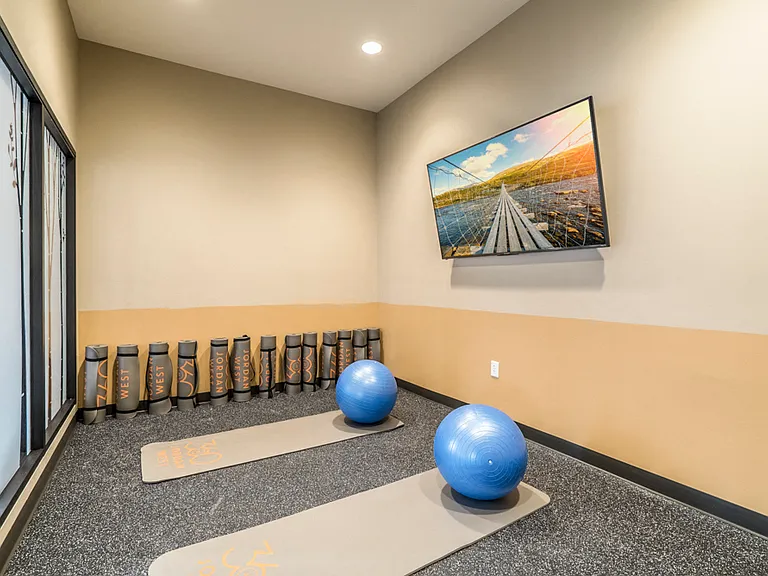 Quiet your mind in our yoga studio with on-demand classes available.