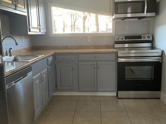 kitchen with new appliances plenty of natural light