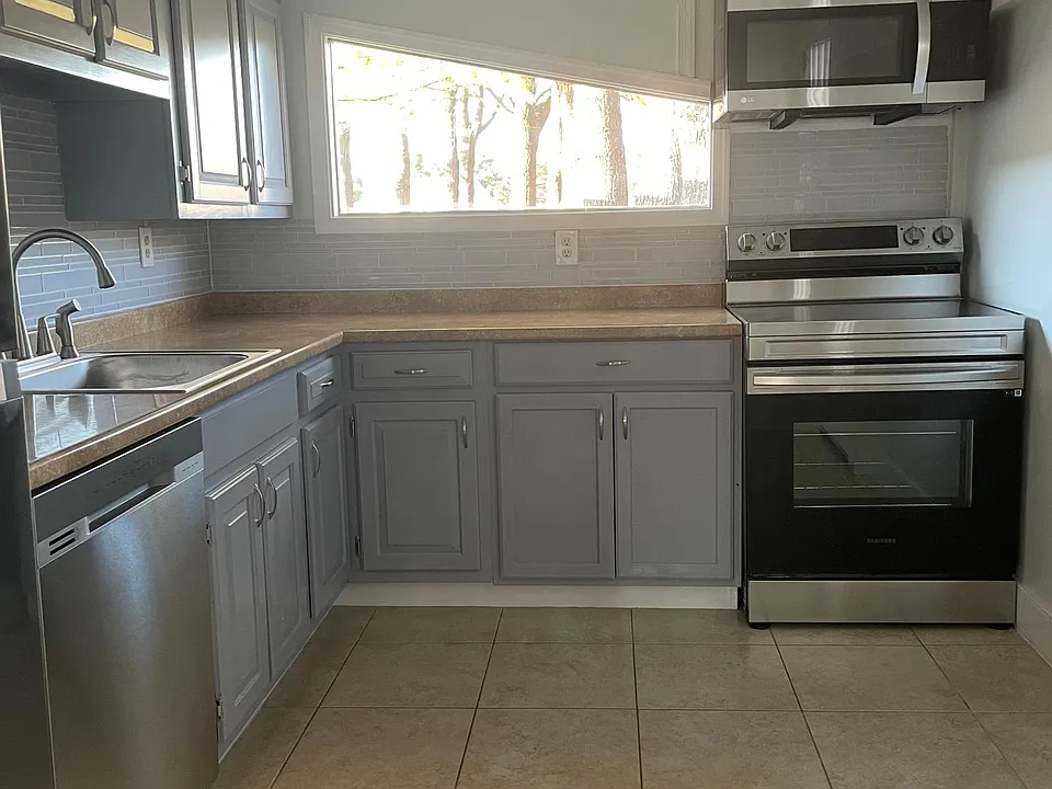 kitchen with new appliances plenty of natural light