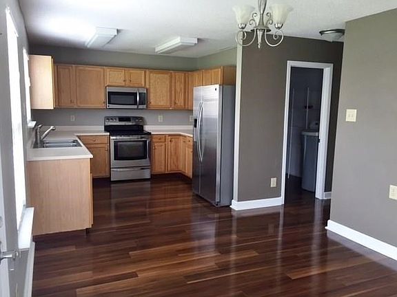 Kitchen and breakfast area with beautiful laminate floor covering, All Stainless steel kitchen appliances are included