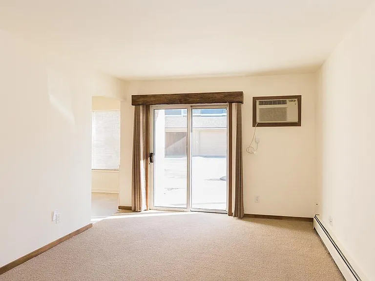 Natural Edge valance with drapes in living room. No verticle blinds. Yeah!