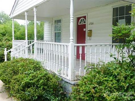 Time to enjoy the summer days and nights on a spacious covered porch. How about a swing to relax on?