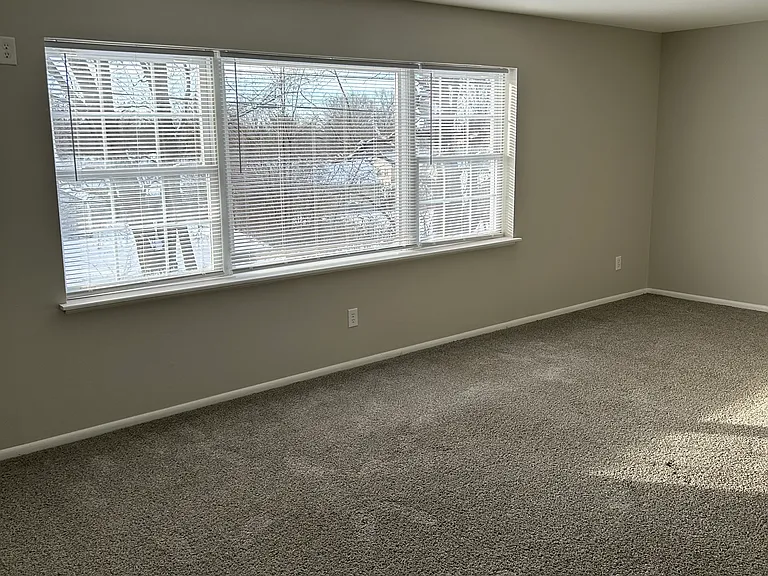 Livingroom with a wonderful oversized picture window for natural lighting; comes with blinds
