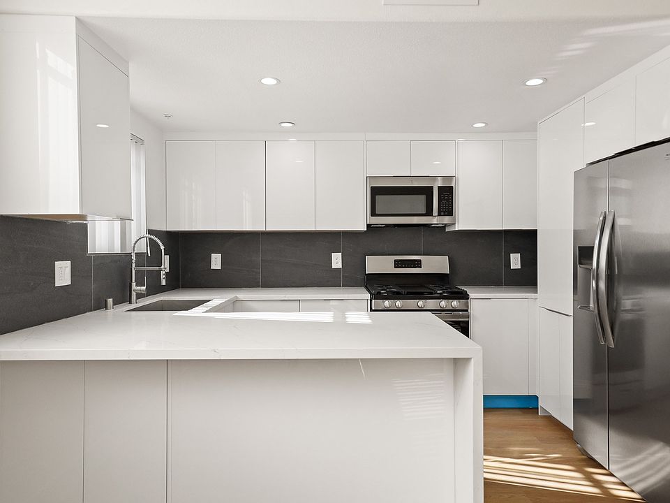 Spacious Kitchen with Energy-Efficient Appliances and Ample Cabinet Storage