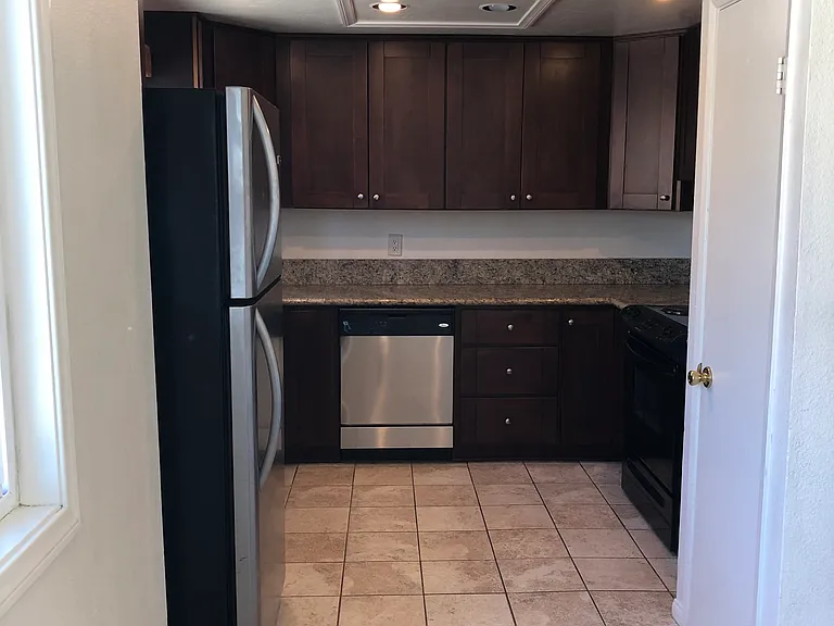 Kitchen showing pantry on right.