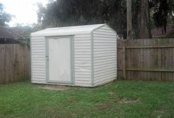 Fenced Back Yard With She